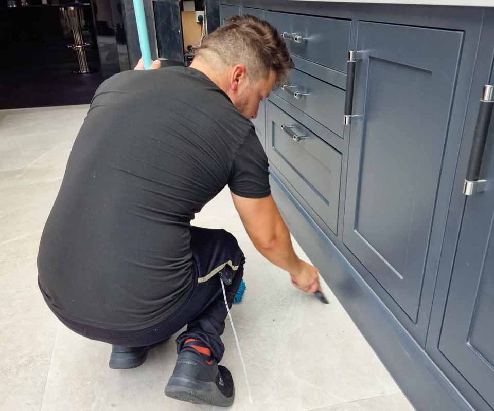 ashworth_clerk_cleaning_floor.jpg